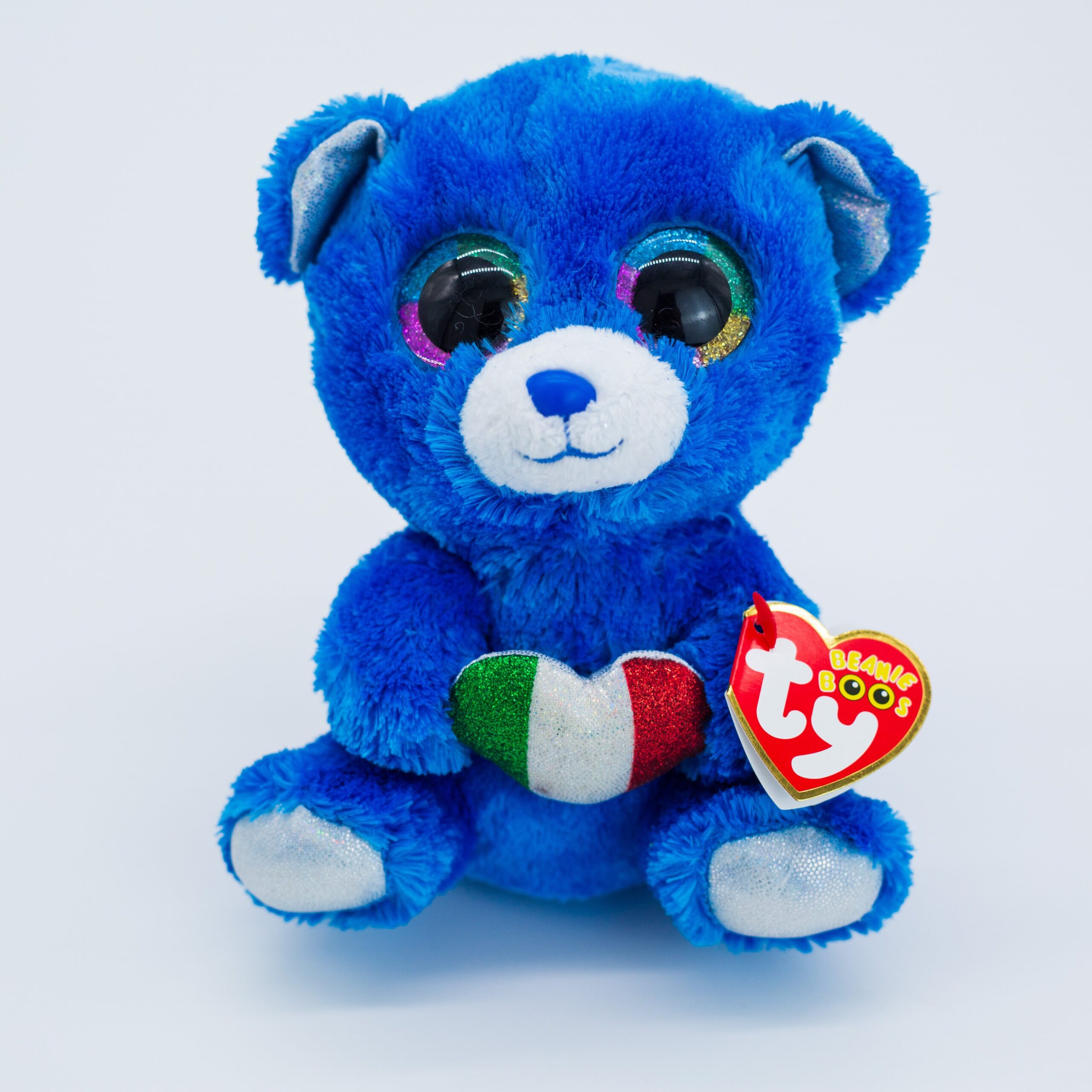 Premium Photo  Beautiful teddy bear with big eyes on a blue